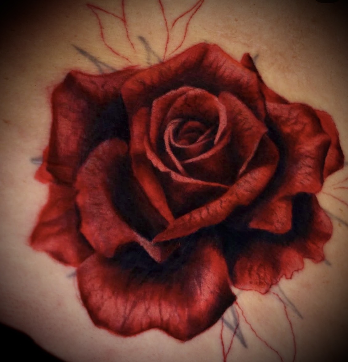 Red realism rose tattoo